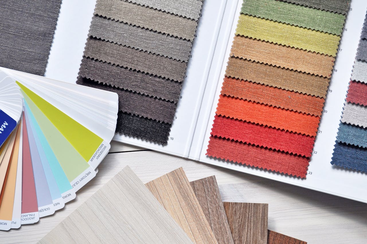 home-hero Colorful fabric and paint swatches laid out for design inspiration and material selection.